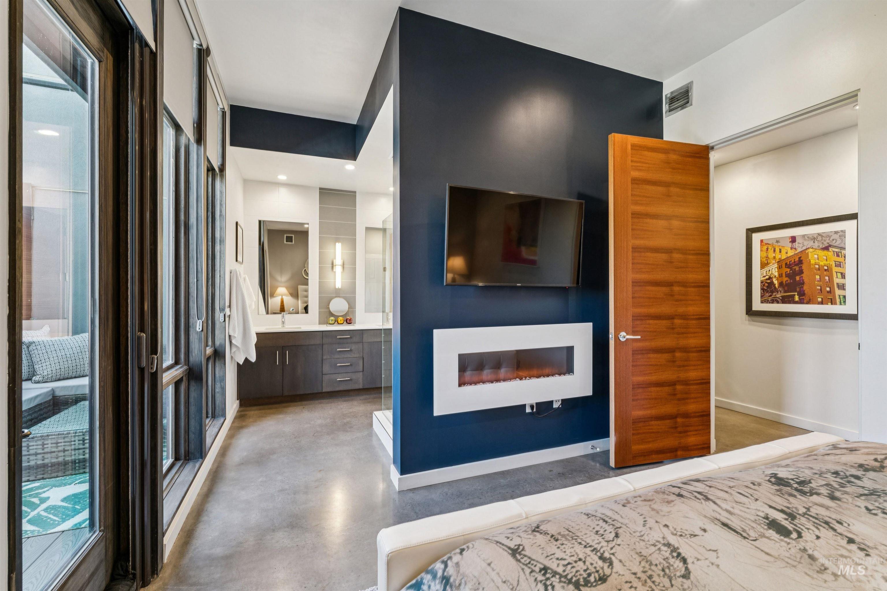 119 South 10th Street, Unit 307 Boise, ID 83702 - Photo 21 of 47 Modern interior featuring a mounted television and a sleek electric fireplace