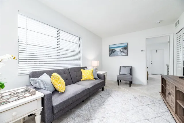 a living room with furniture and a table