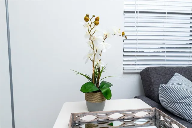 a vase of flowers sitting on a table