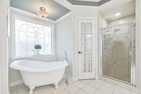 a bathroom with a bathtub and shower