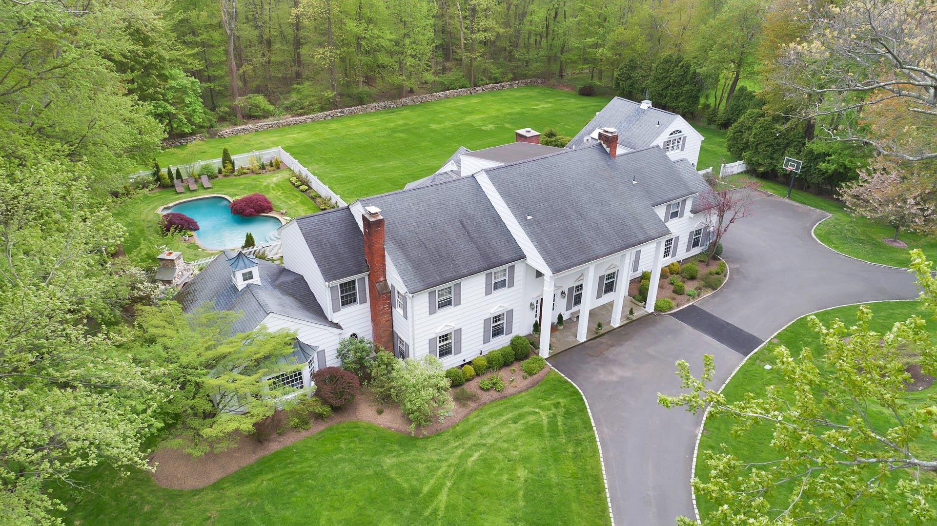 100 Stephen Mather Road Darien, CT 06820 - Photo 2 of 38 an aerial view of a house with garden space and street view