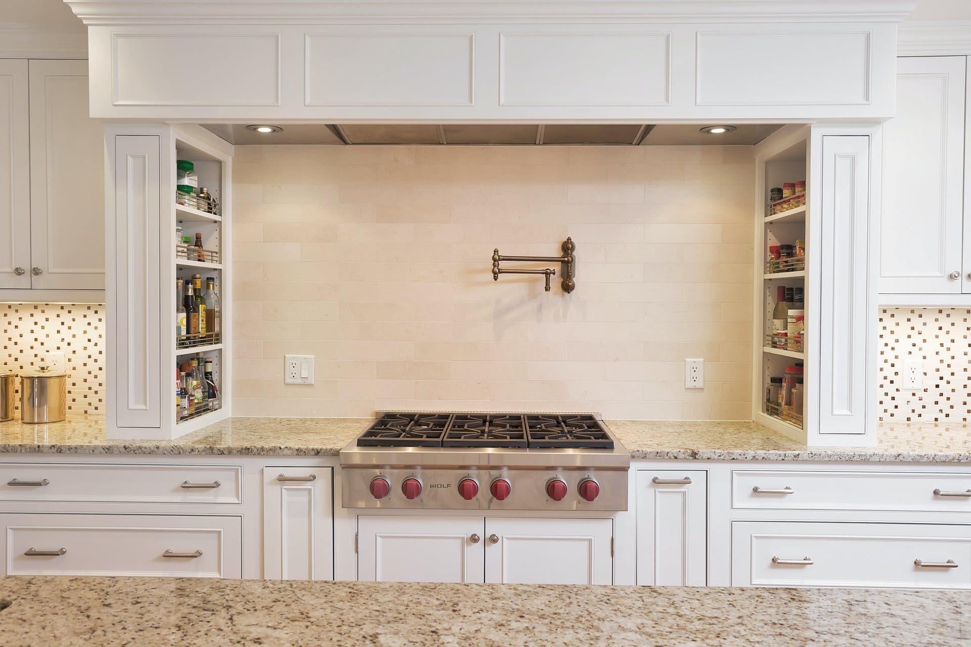 100 Stephen Mather Road Darien, CT 06820 - Photo 12 of 38 a kitchen with a stove and a window