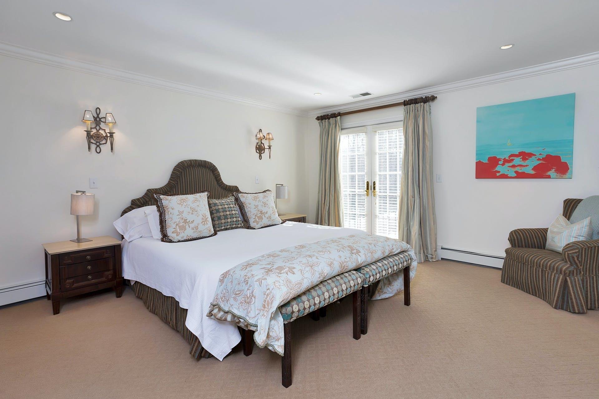 100 Stephen Mather Road Darien, CT 06820 - Photo 22 of 38 a bedroom with a bed and a couch