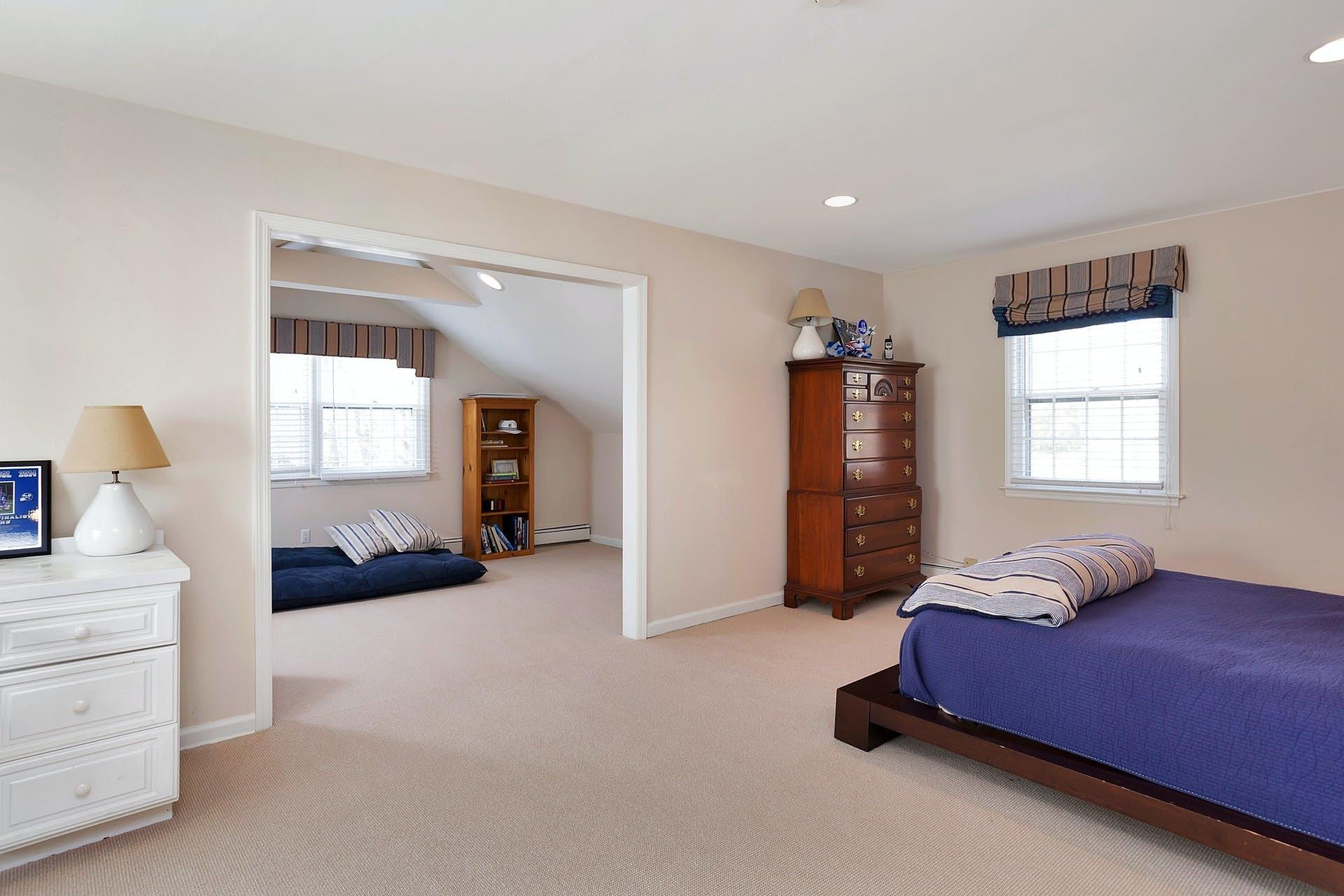 100 Stephen Mather Road Darien, CT 06820 - Photo 27 of 38 a bedroom with furniture and window