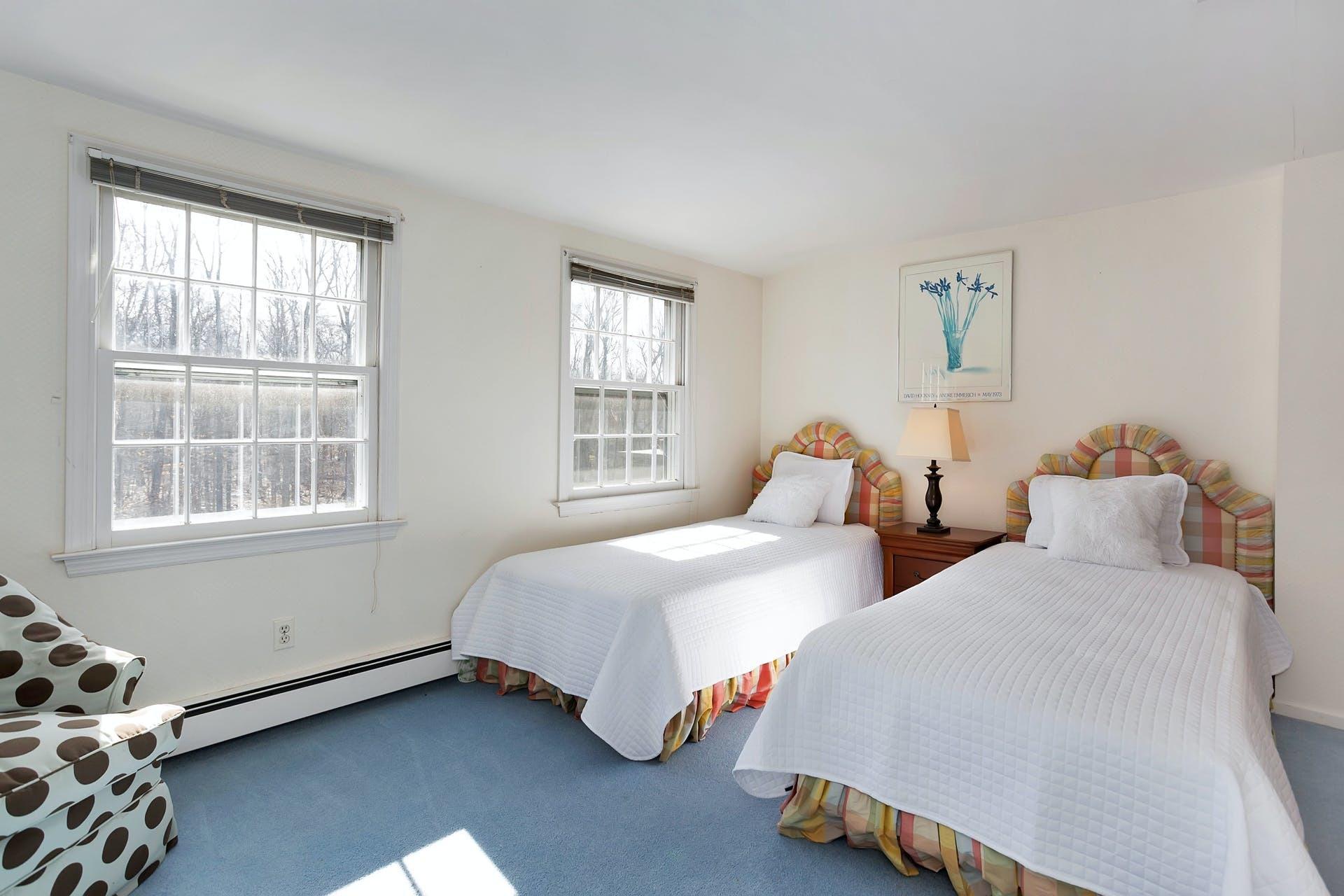 100 Stephen Mather Road Darien, CT 06820 - Photo 30 of 38 a bedroom with two beds and a window