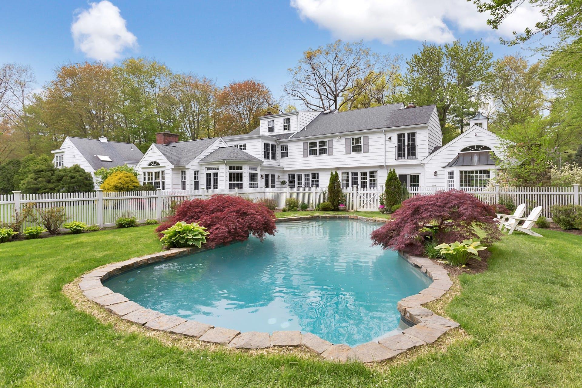 100 Stephen Mather Road Darien, CT 06820 - Photo 35 of 38 a view of a house with a yard and sitting area