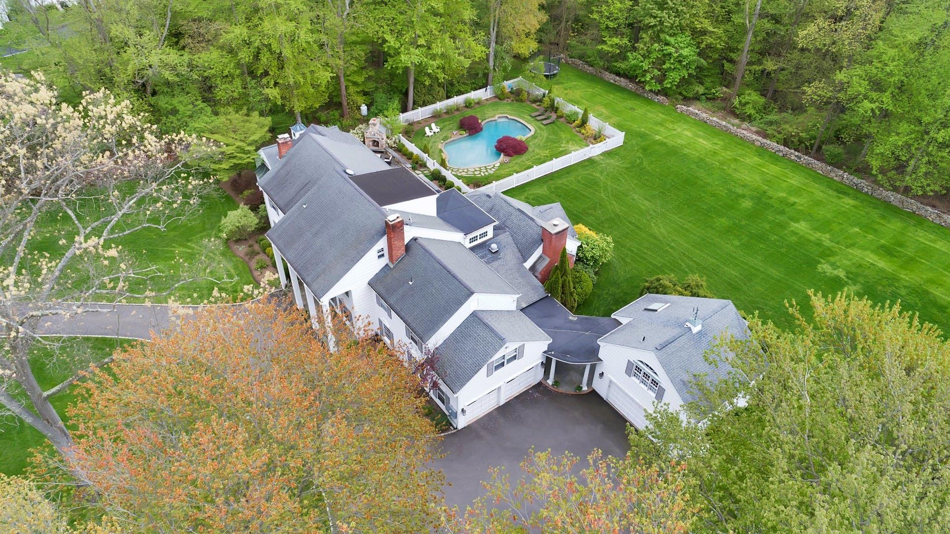 100 Stephen Mather Road Darien, CT 06820 - Photo 38 of 38 an aerial view of a house with pool yard seating area and yard