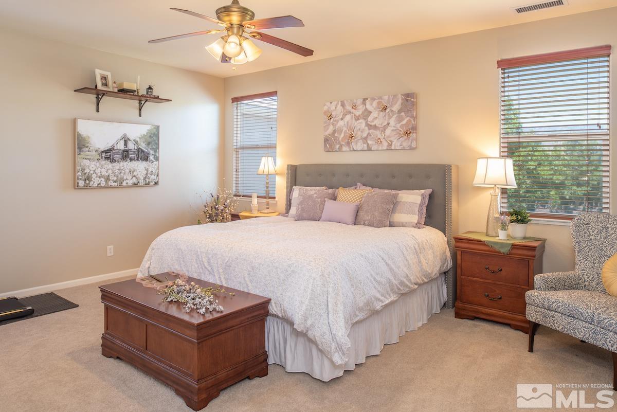 11225 Messina Way Reno, NV 89521 - Photo 5 of 40 a bedroom with a bed and a painting on the wall