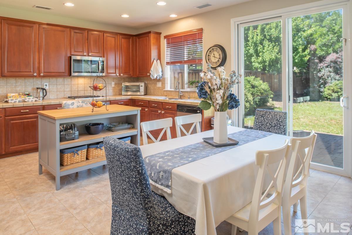 11225 Messina Way Reno, NV 89521 - Photo 8 of 40 a view of kitchen with furniture and a potted plant