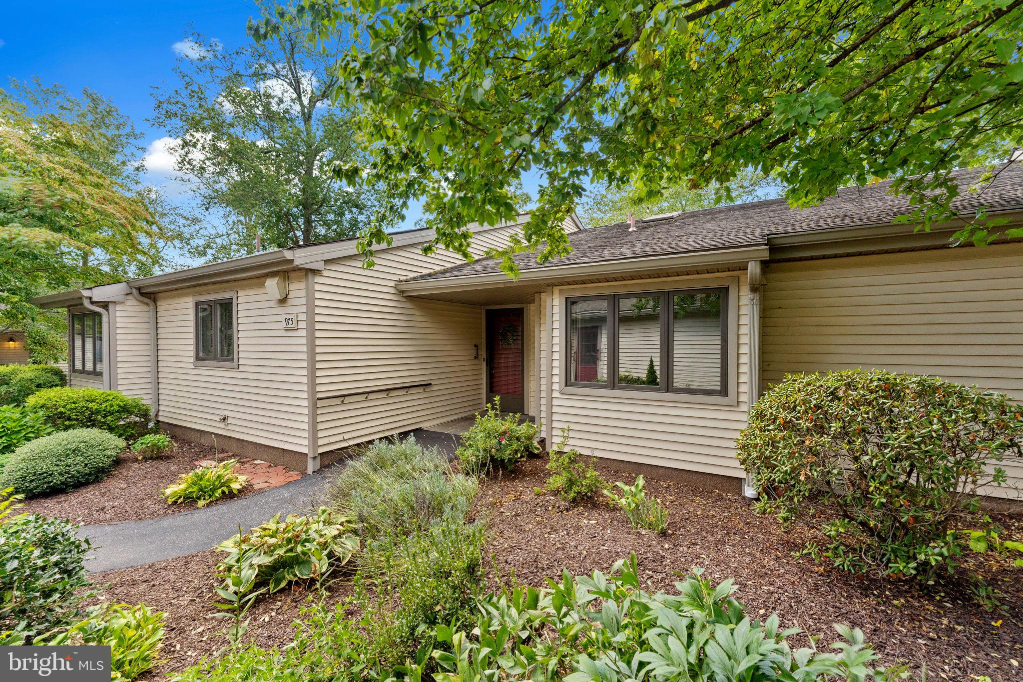 975 Kennett Way West Chester, PA 19380 - Photo 1 of 48 a front view of a house with garden