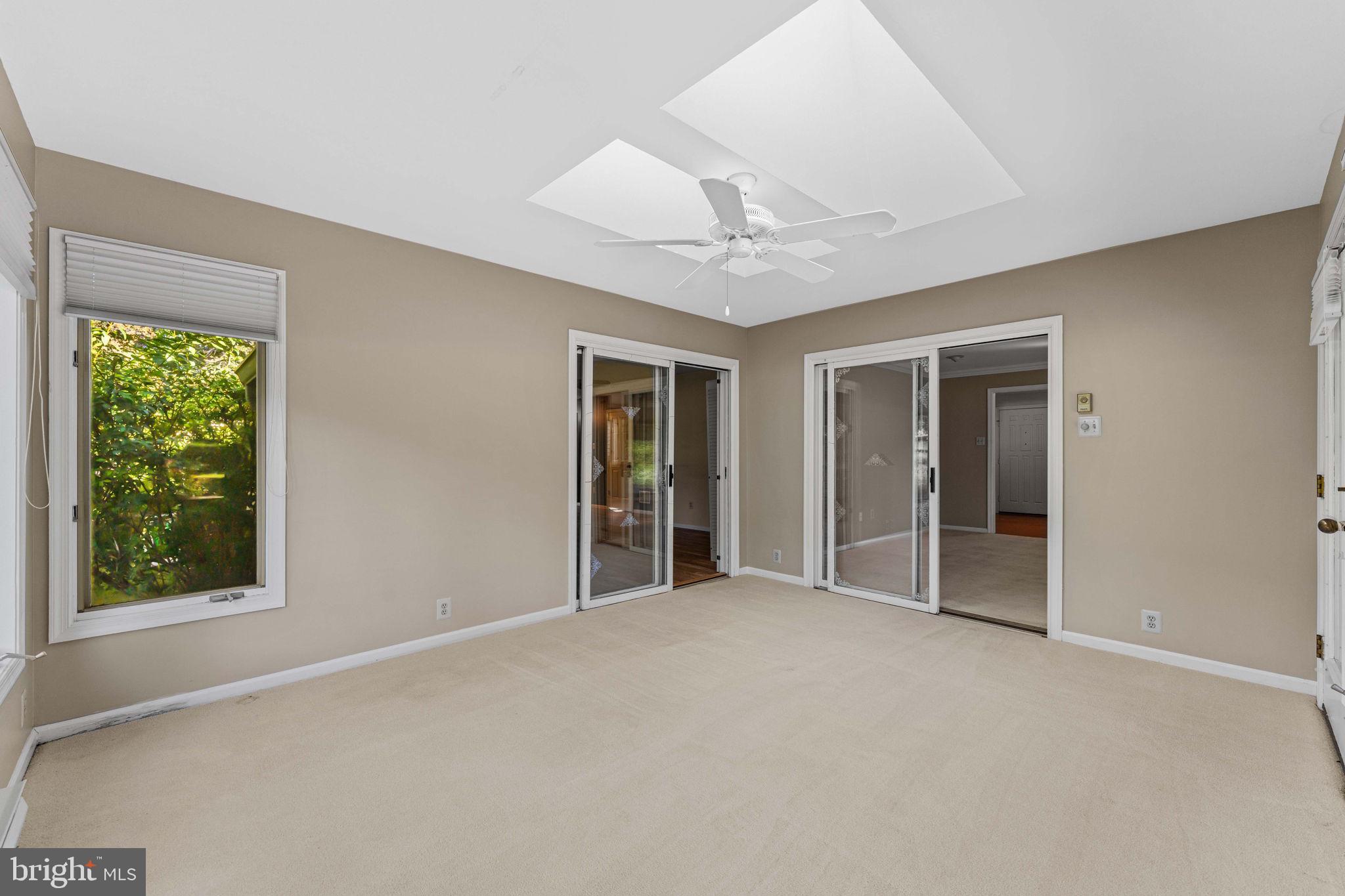 975 Kennett Way West Chester, PA 19380 - Photo 12 of 48 a view of an empty room with window and chandelier fan