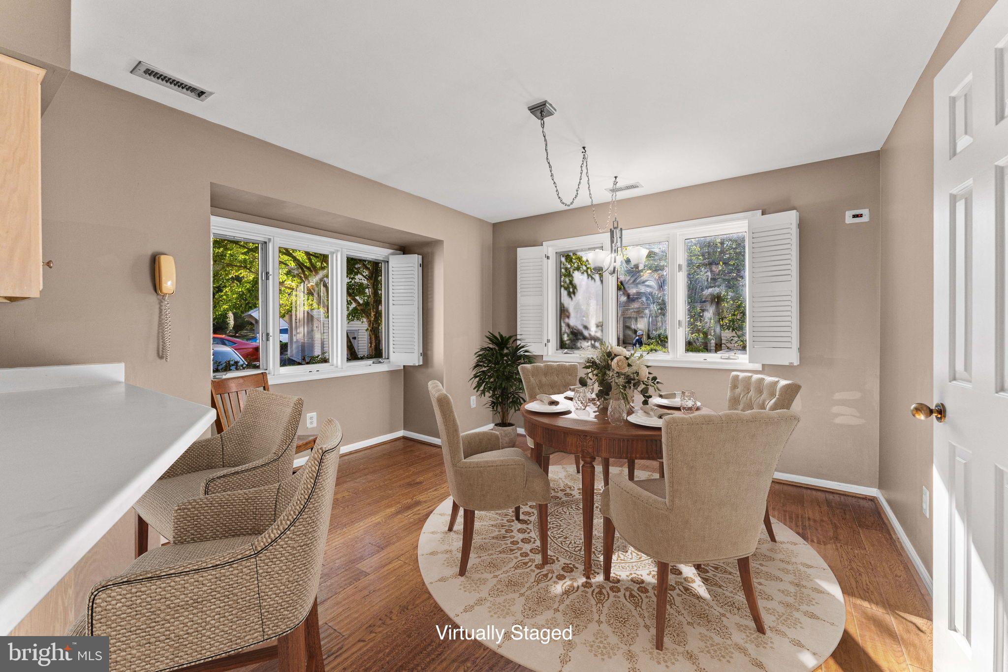 975 Kennett Way West Chester, PA 19380 - Photo 16 of 48 a dining room with furniture a chandelier and wooden floor