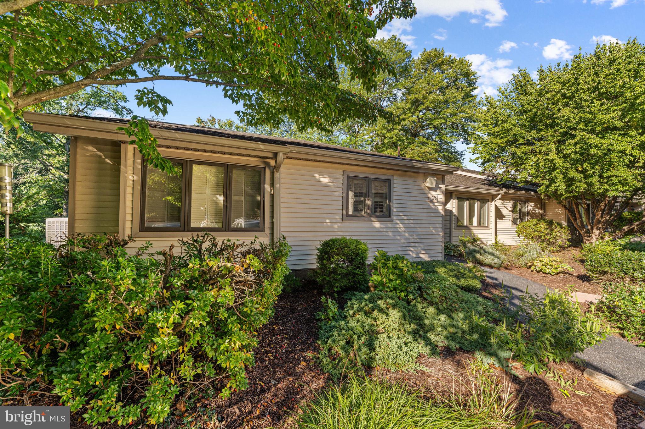 975 Kennett Way West Chester, PA 19380 - Photo 3 of 48 front view of a house with a garden