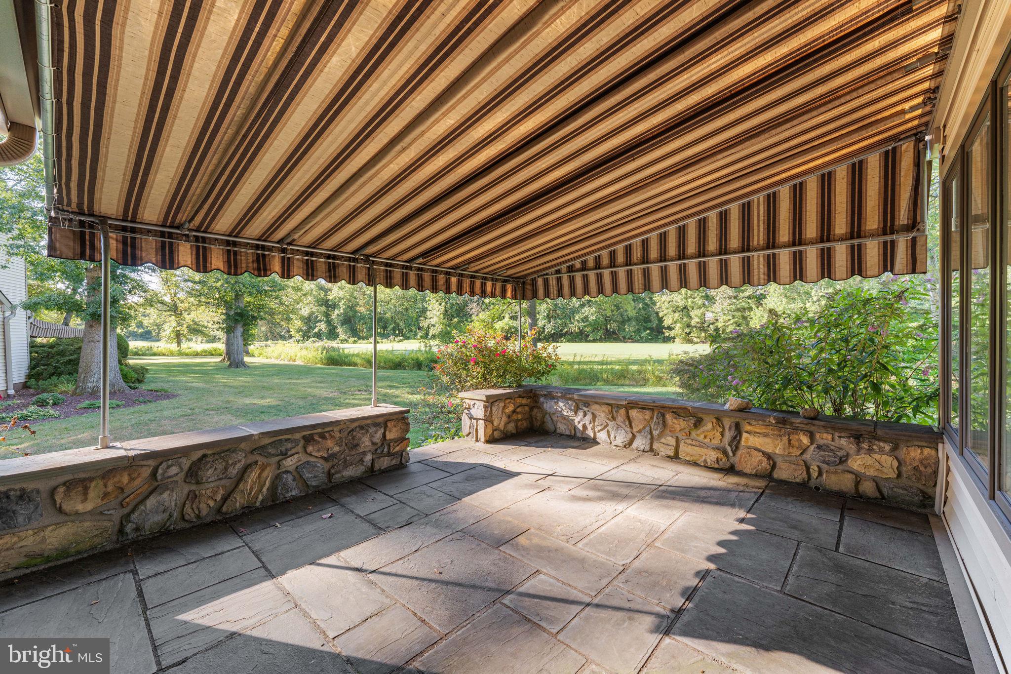 975 Kennett Way West Chester, PA 19380 - Photo 37 of 48 a view of a patio with table and chairs barbeque and wooden fence