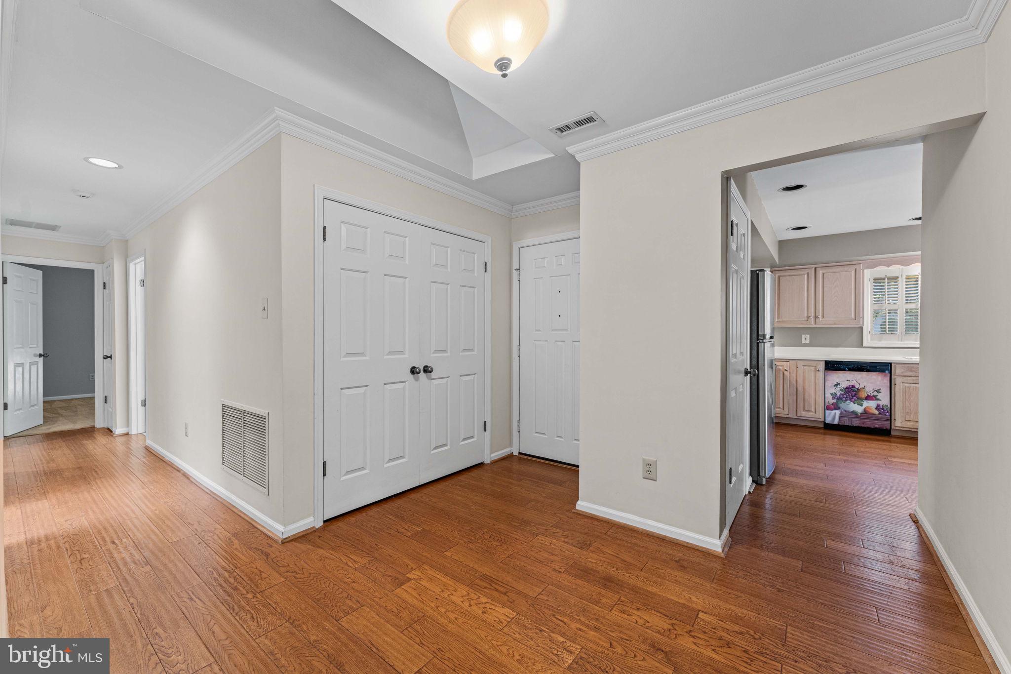 975 Kennett Way West Chester, PA 19380 - Photo 5 of 48 a view of a room with wooden floor and a ceiling fan
