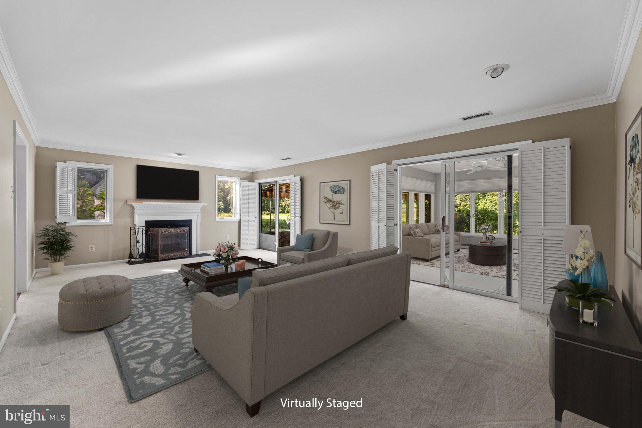 975 Kennett Way West Chester, PA 19380 - Photo 7 of 48 a living room with furniture a fireplace and a flat screen tv