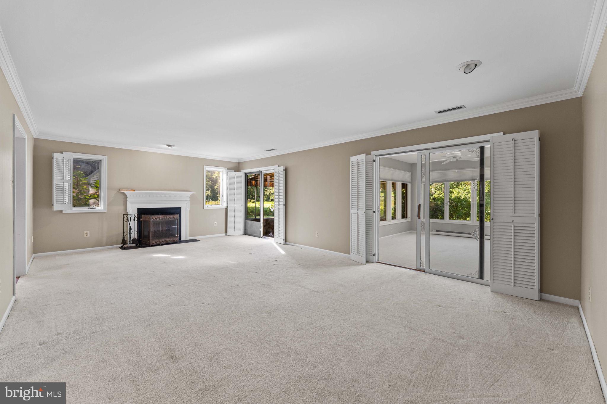 975 Kennett Way West Chester, PA 19380 - Photo 8 of 48 a view of an empty room with a fireplace