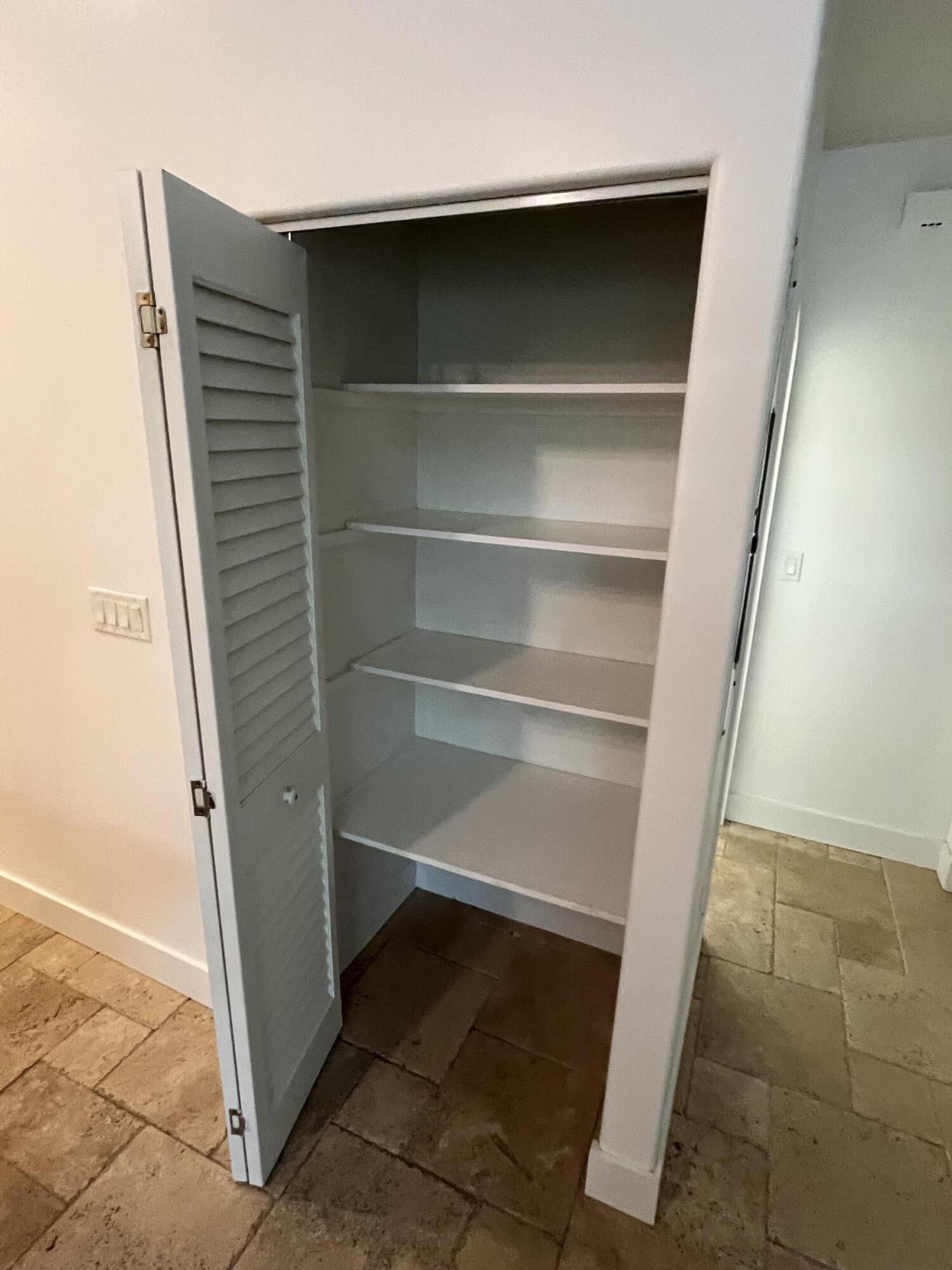 639 Cabrera Street Key Largo, FL 33037 - Photo 18 of 24 a view of walk in closet with empty racks