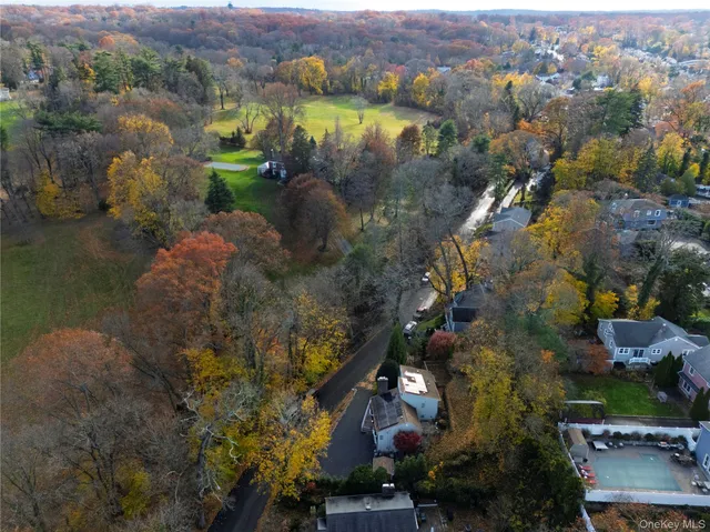 an aerial view of a houses with outdoor space