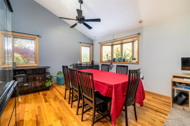 a view of a dining room with furniture window and outside view