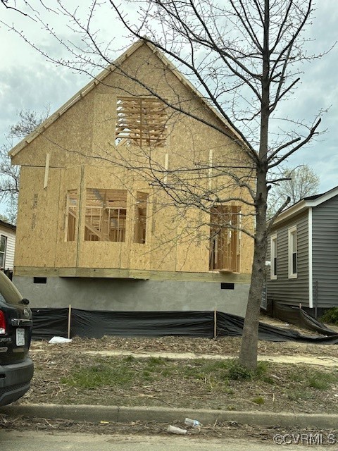 3303 Decatur Street Richmond, VA 23224 - Photo 2 of 3 a wooden house with large trees next to it