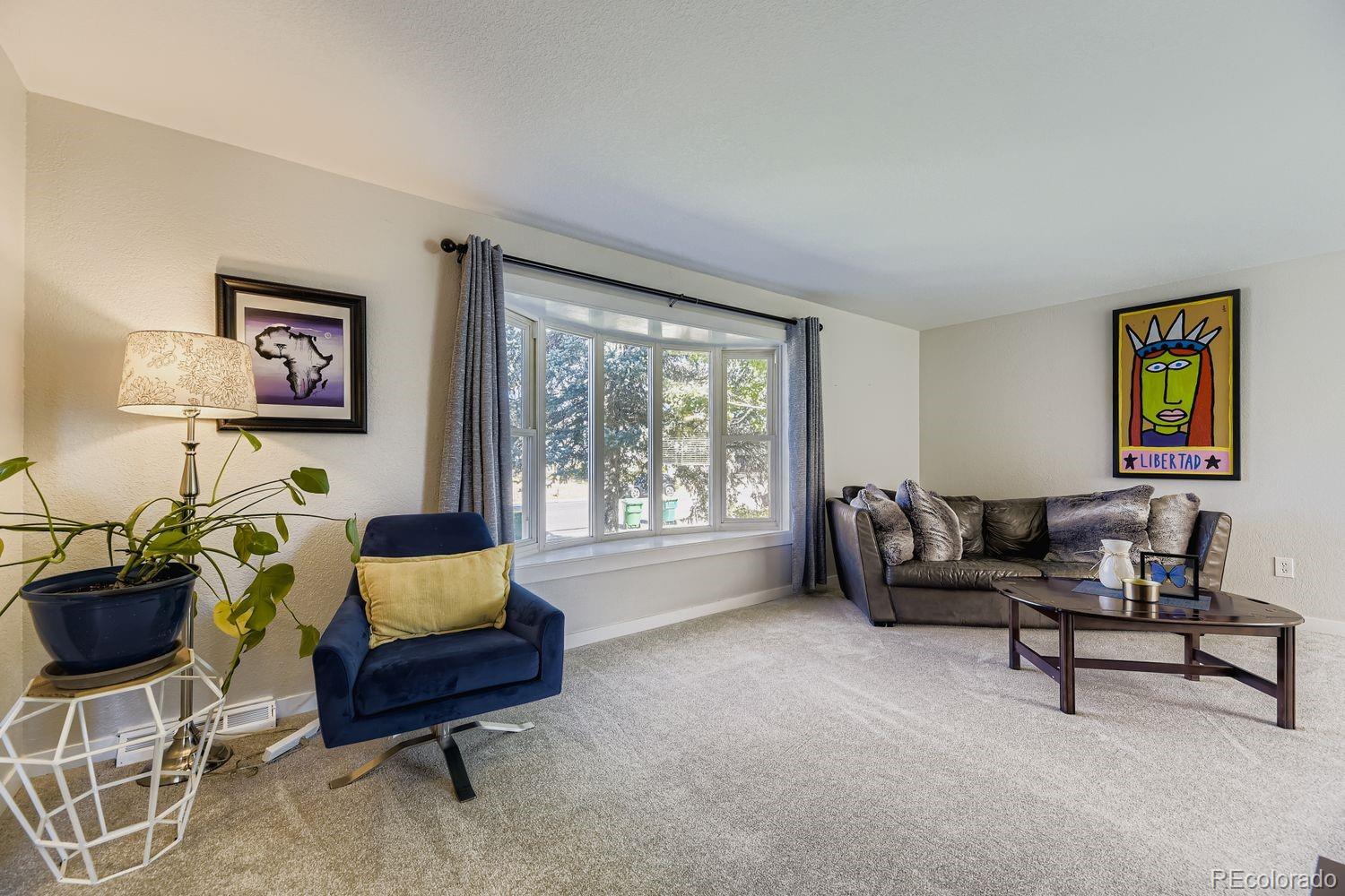 7161 South Franklin Street Centennial, CO 80122 - Photo 11 of 28 a living room with furniture and a window