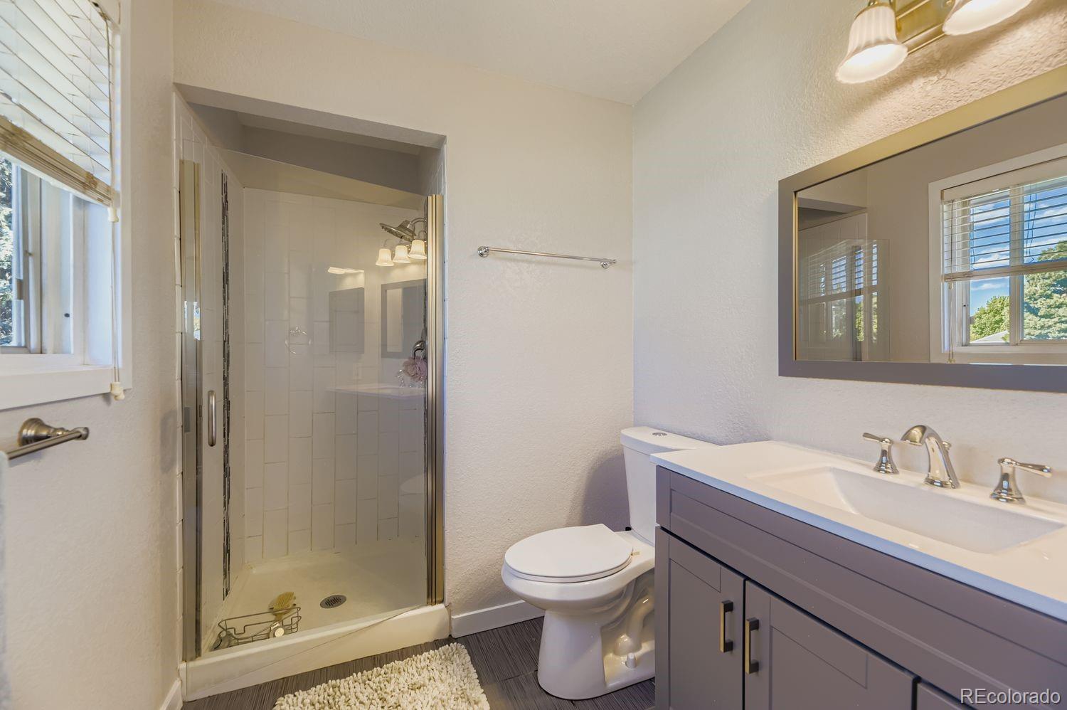 7161 South Franklin Street Centennial, CO 80122 - Photo 16 of 28 a bathroom with a sink a toilet and shower
