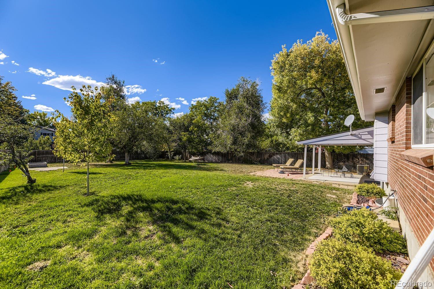 7161 South Franklin Street Centennial, CO 80122 - Photo 25 of 28 a view of a house with a backyard