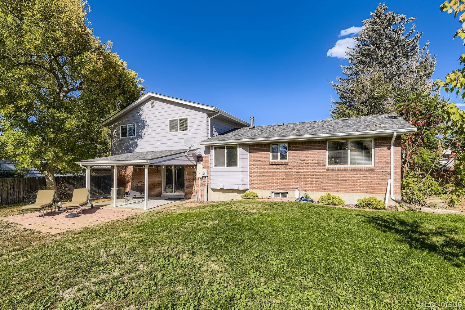 7161 South Franklin Street Centennial, CO 80122 - Photo 26 of 28 a front view of a house with a garden