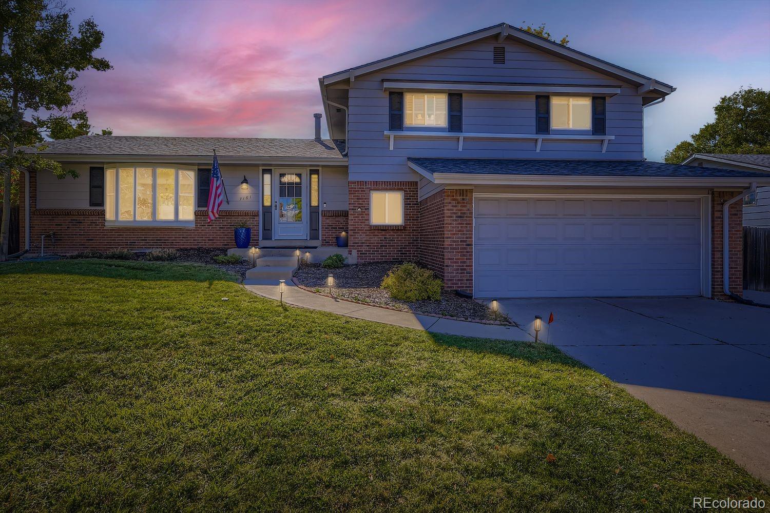 7161 South Franklin Street Centennial, CO 80122 - Photo 27 of 28 a front view of a house with garden
