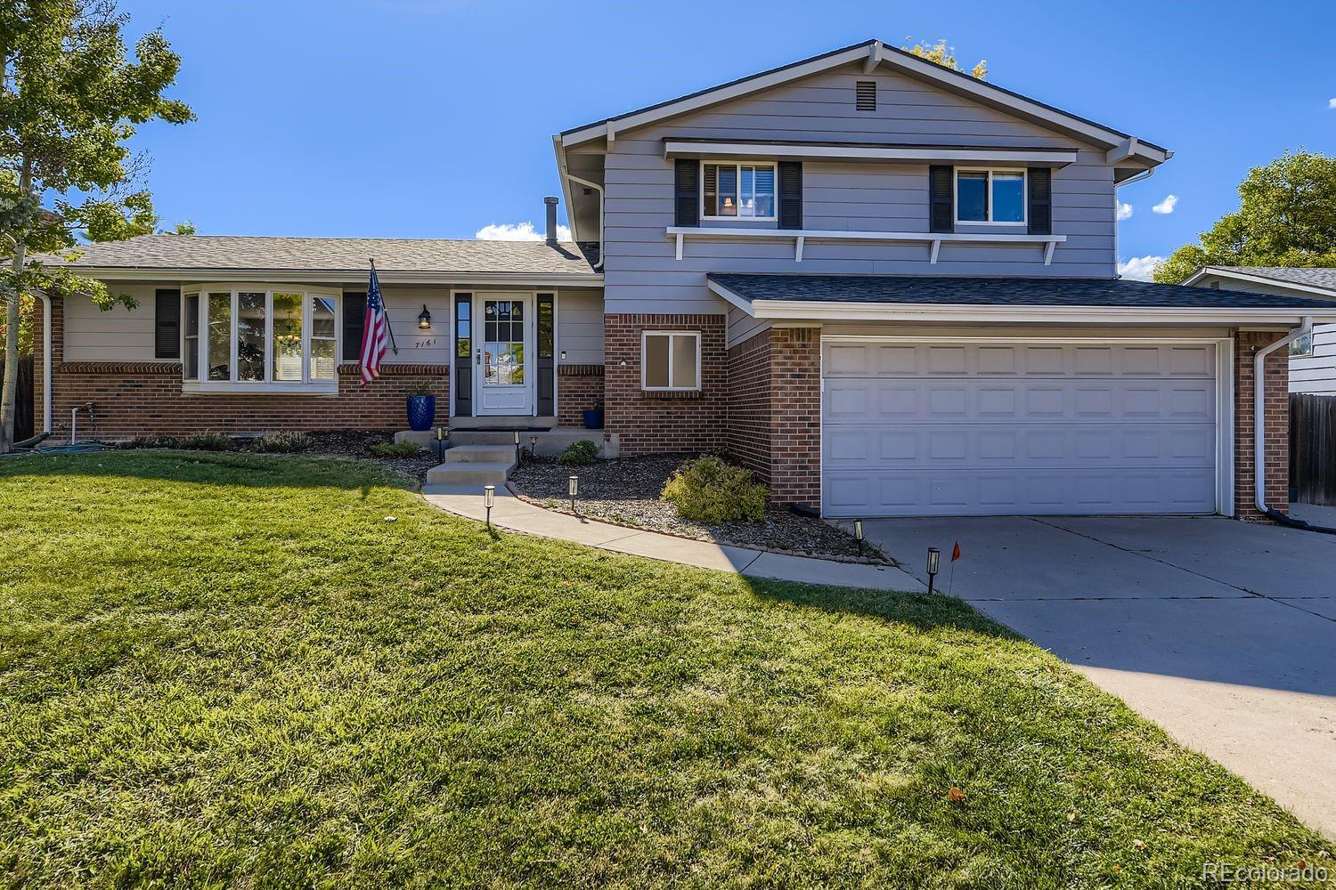 7161 South Franklin Street Centennial, CO 80122 - Photo 28 of 28 a front view of a house with garden