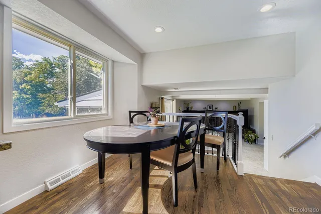 a view of a dining room with furniture and window