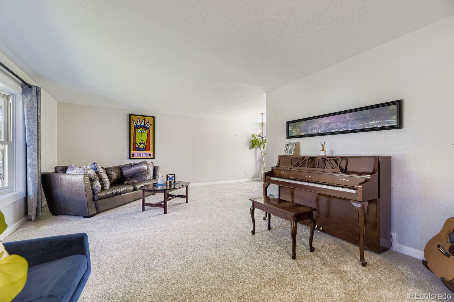 7161 South Franklin Street Centennial, CO 80122 - Photo 9 of 28 a living room with furniture and a piano