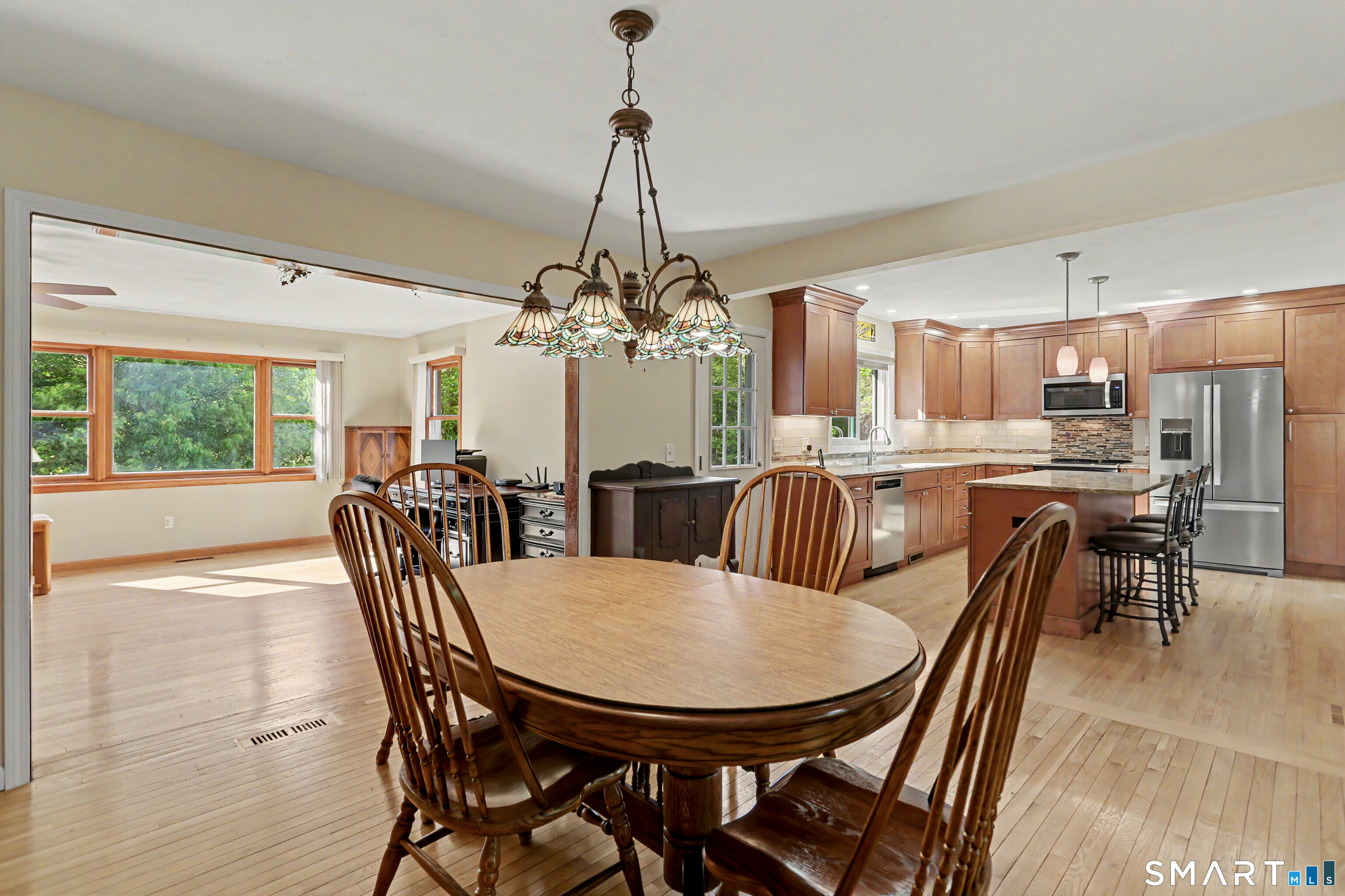 632 Wheelers Farm Road Orange, CT 06477 - Photo 12 of 39 a view of a dining room with furniture window and outside view