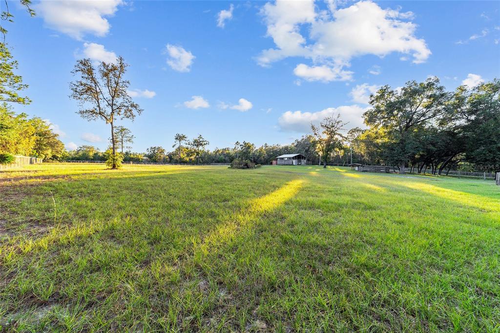 13200 Southwest 95th Street Dunnellon, FL 34432 - Photo 16 of 23 a view of a swimming pool with an outdoor space and seating area