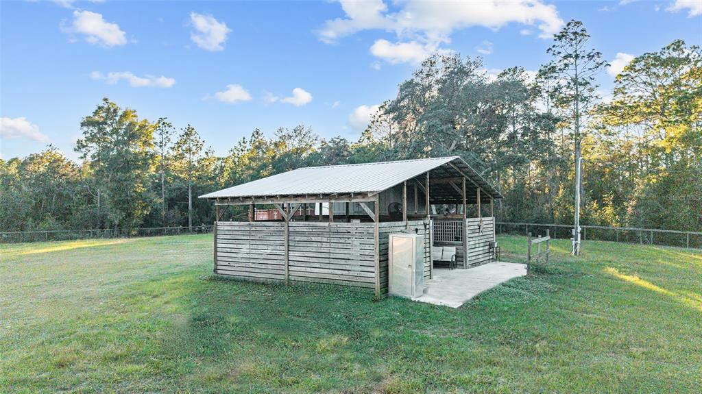 13200 Southwest 95th Street Dunnellon, FL 34432 - Photo 4 of 23 a view of a house with a backyard