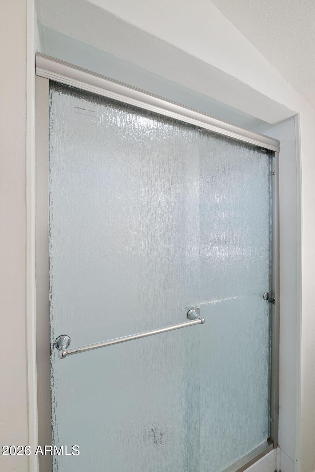 7 South Catalina Street Gilbert, AZ 85233 - Photo 20 of 34 a bathroom with a glass shower door