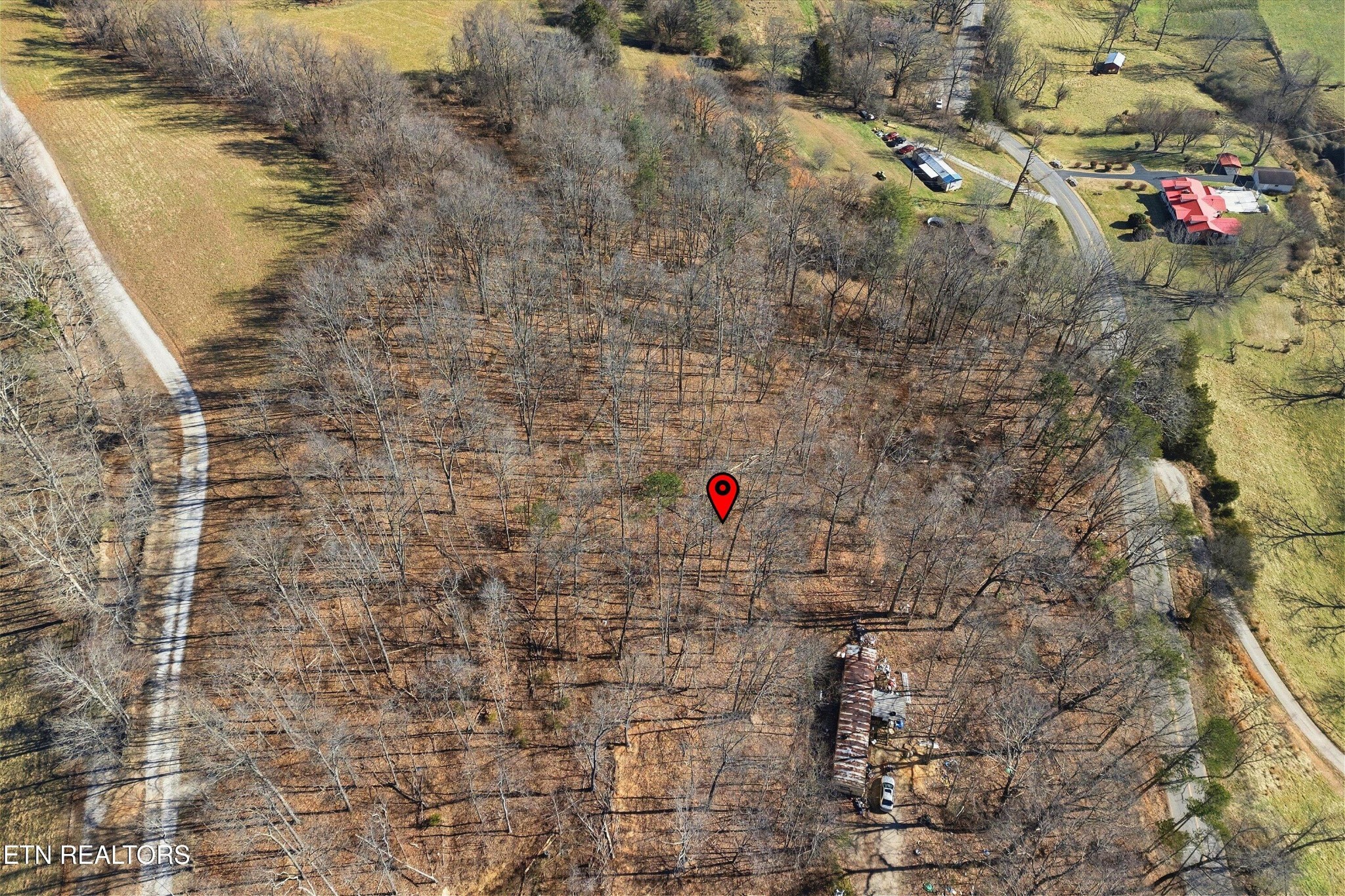 0 Sugar Hollow Road La Follette, TN 37766 - Photo 15 of 21 a white building with trees in the background