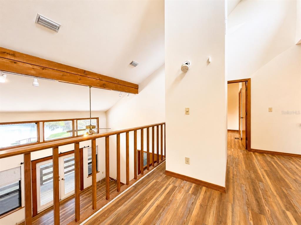 7119 Immokalee Road Keystone Heights, FL 32656 - Photo 23 of 50 a view of hallway with wooden floor