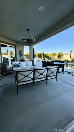 a living room with furniture pool table table and a fireplace