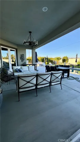a living room with furniture pool table table and a fireplace