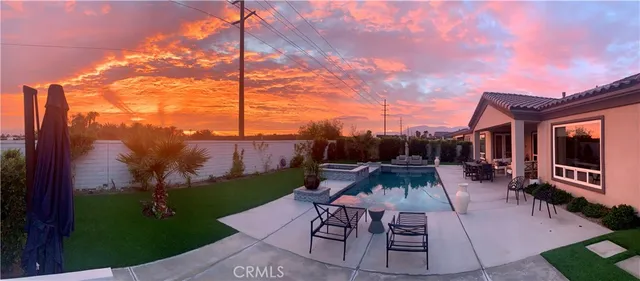a view of a patio with couches fire pit and chairs