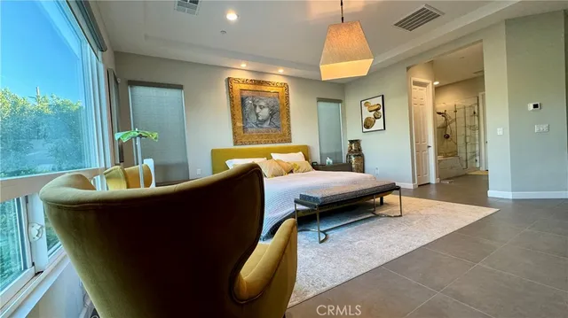 a bedroom with bed and window