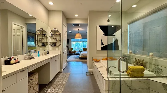 a bathroom with a sink a mirror and shower