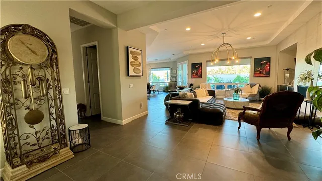 a living room with furniture a dining table and chairs