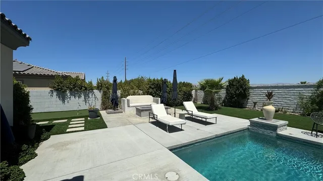 a view of a chairs and table in patio