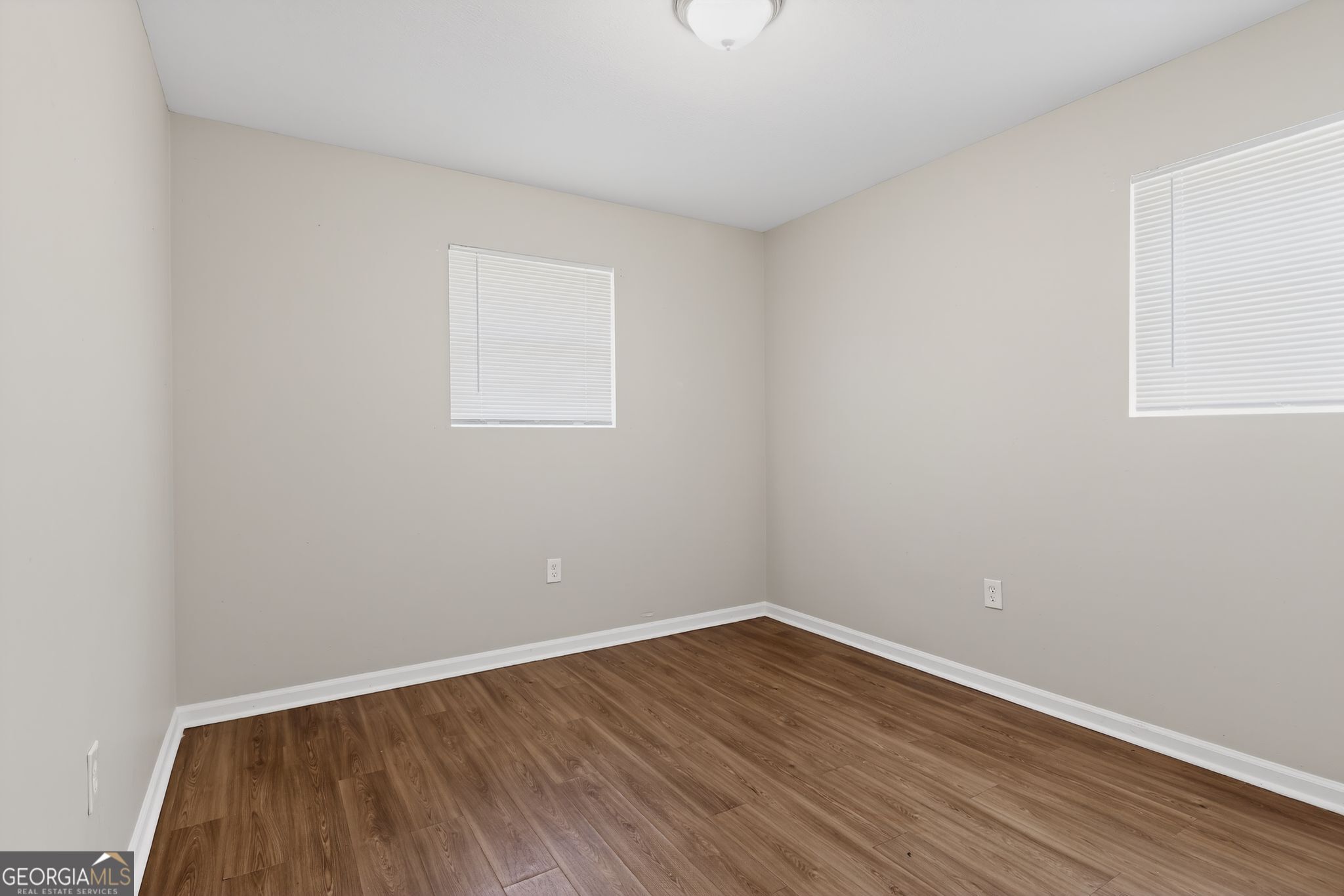 2508 Dexter Road Augusta, GA 30906 - Photo 16 of 33 a view of an empty room with wooden floor and a window