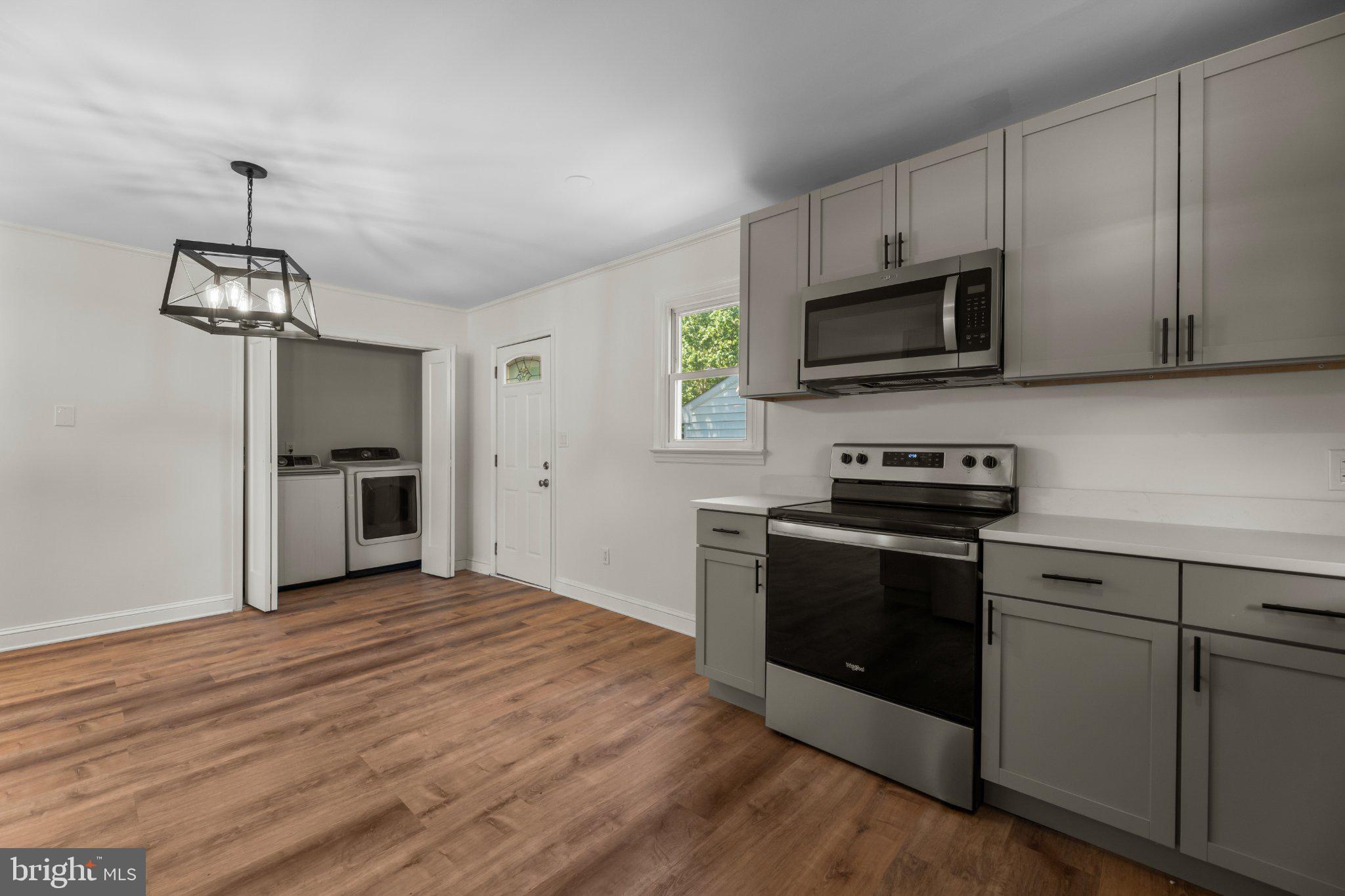 12 Oak Street Cambridge, MD 21613 - Photo 10 of 30 Modern kitchen with sleek finishes.