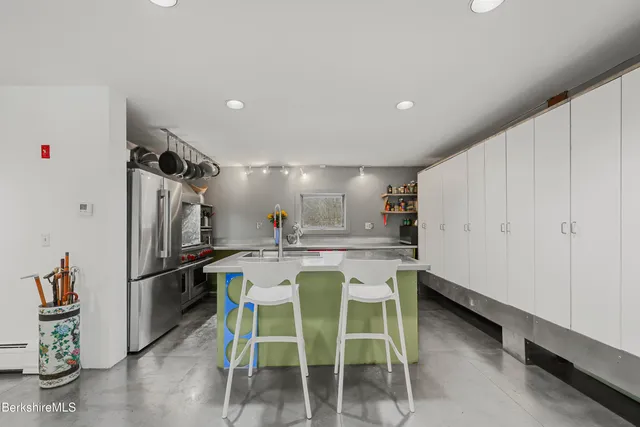 a kitchen with a table and chairs in it