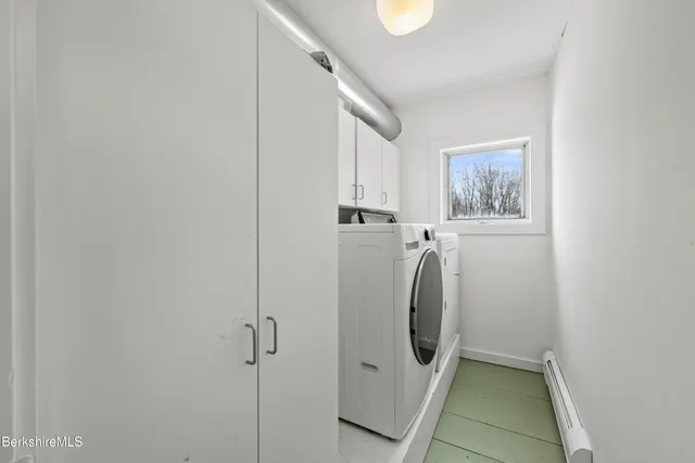 a view of entryway dining room and hall with wooden floor
